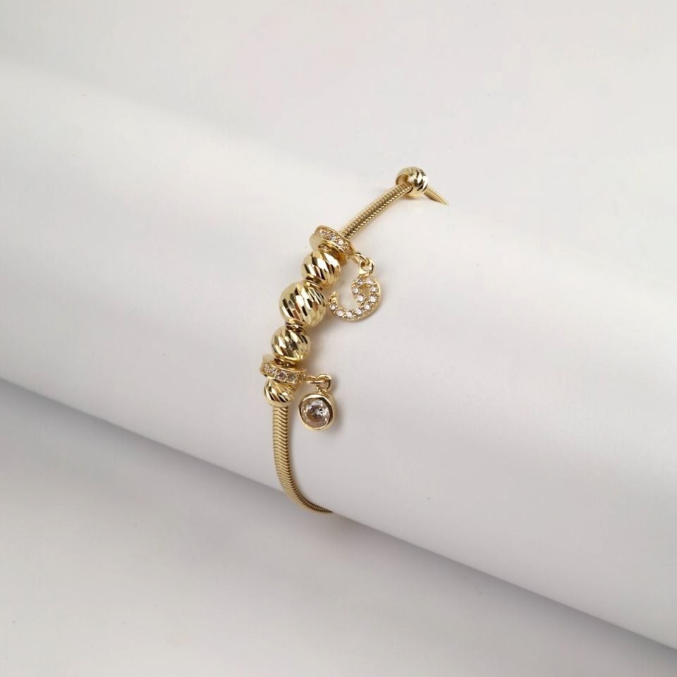 14 Carat Gold Dorika Vav and Solitaire Figured Charm Bracelet