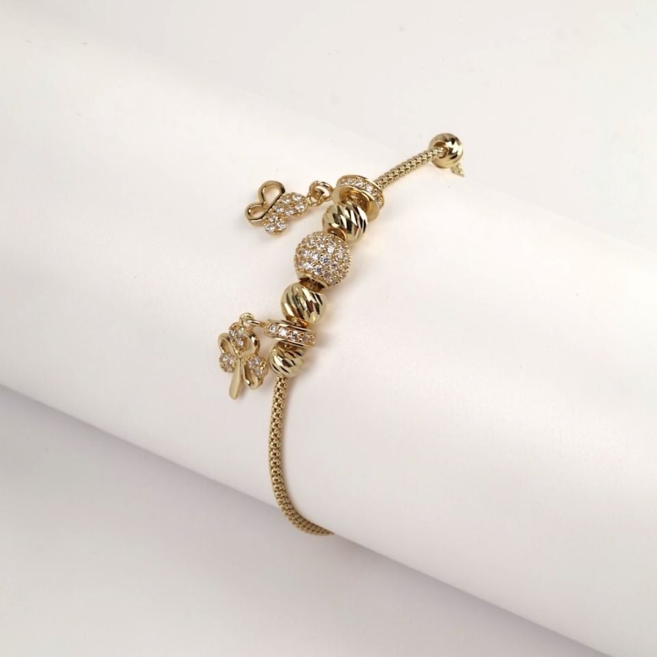14K Gold Butterfly and Flower Figured Charm Bracelet